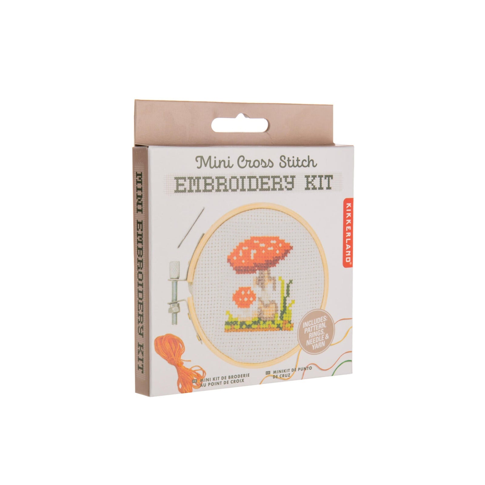 Embroidery kit packaging with mushroom design on a white background