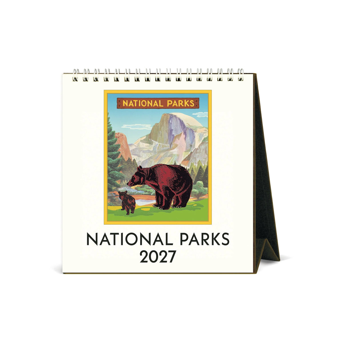 A 2027 spiral-bound National Parks desk calendar with a cream-colored cover featuring an illustration of a bear in a mountain landscape and the text 'NATIONAL PARKS 2027'.