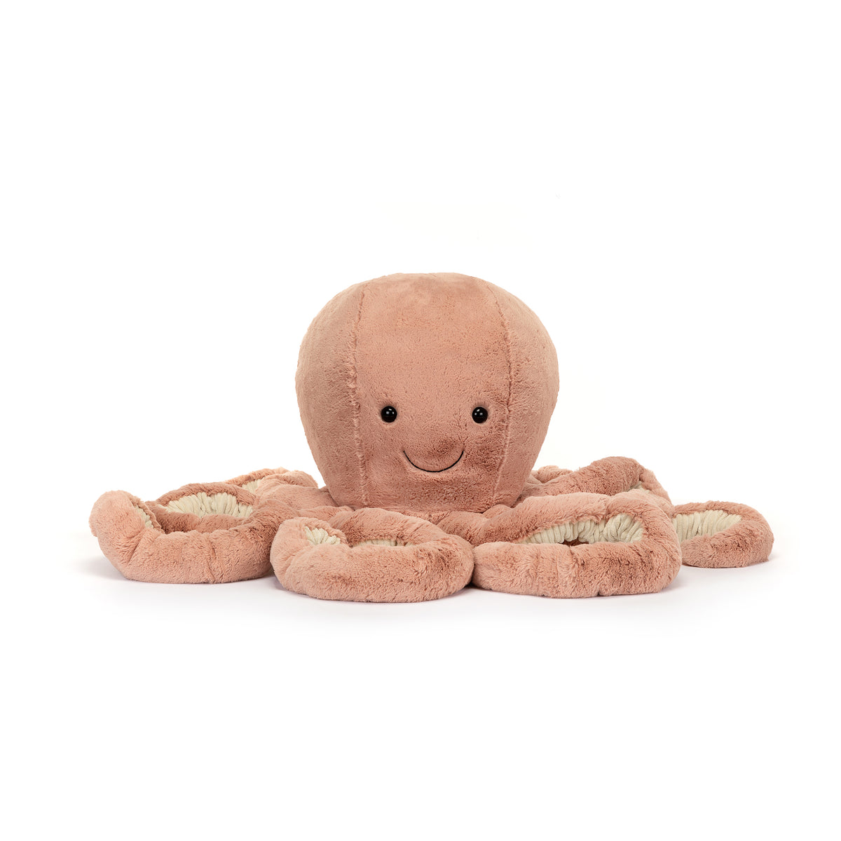 A plush Jellycat octopus toy in a dusty peach-pink color with a smiling face and cream-colored inner tentacles, photographed on a seamless white background.