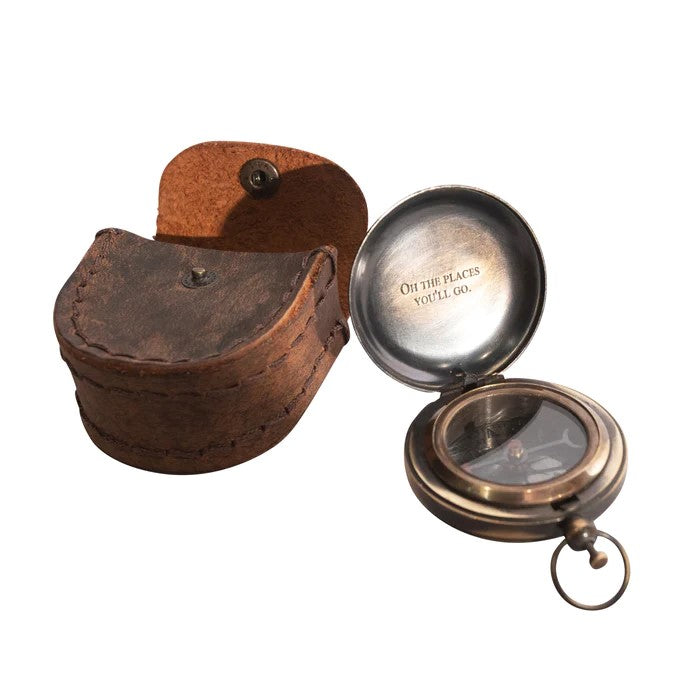 Our "Oh The Places You'll Go"! This push button compass with a leather carrying pouch is an invitation to celebrate the wanderlust within, the wisdom of timeless stories, and the pure delight of exploration. Includes real leather carrying pouch Compass diameter: 1.75" Leather pouch dimensions: 2.75" x 2" x 1.25".