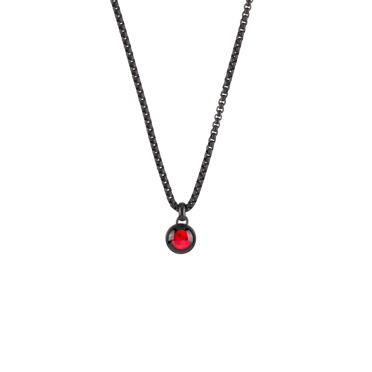 A black chain necklace with a small circular pendant featuring a vibrant red faceted gemstone, set against a plain white background.