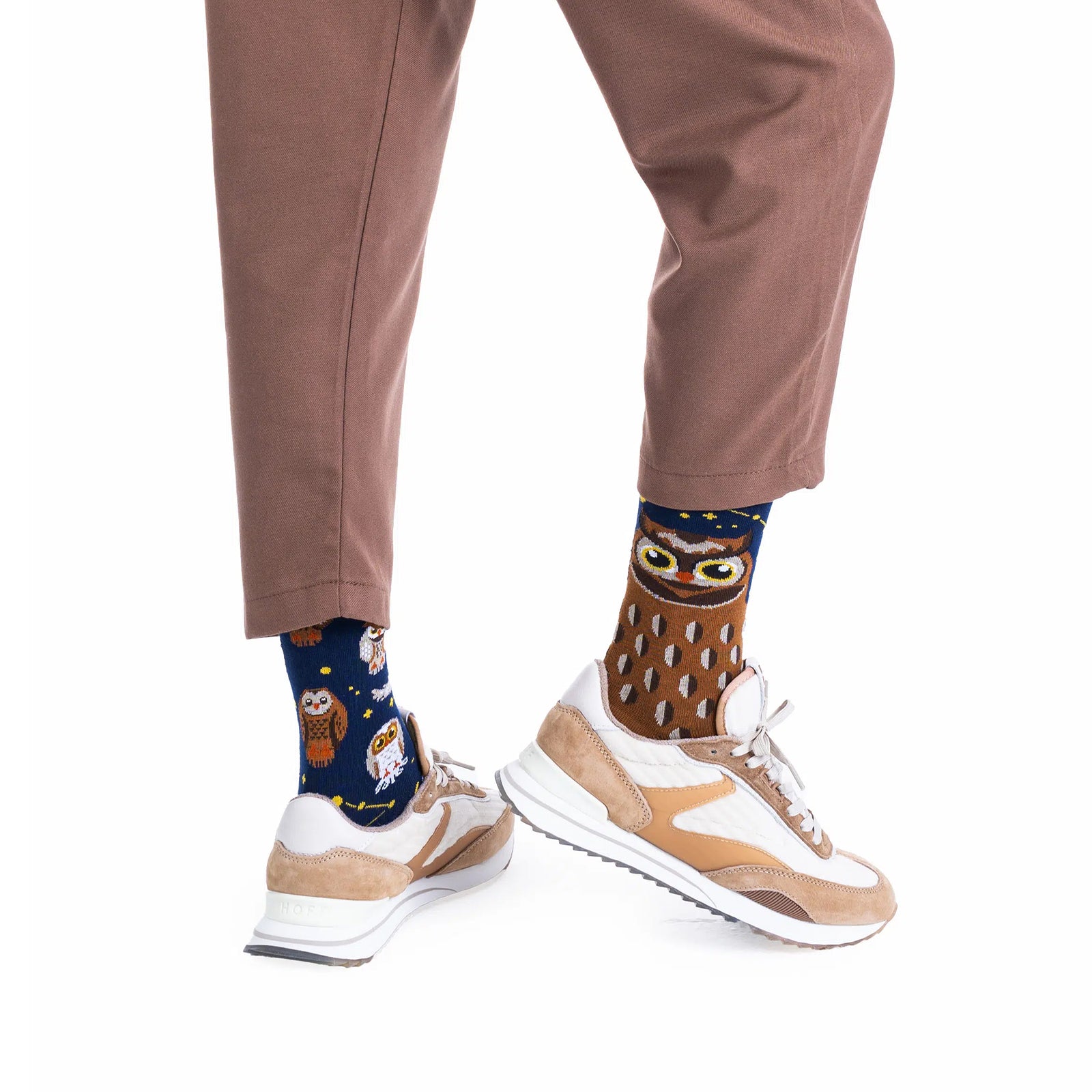 Two socks with owl patterns on a white background