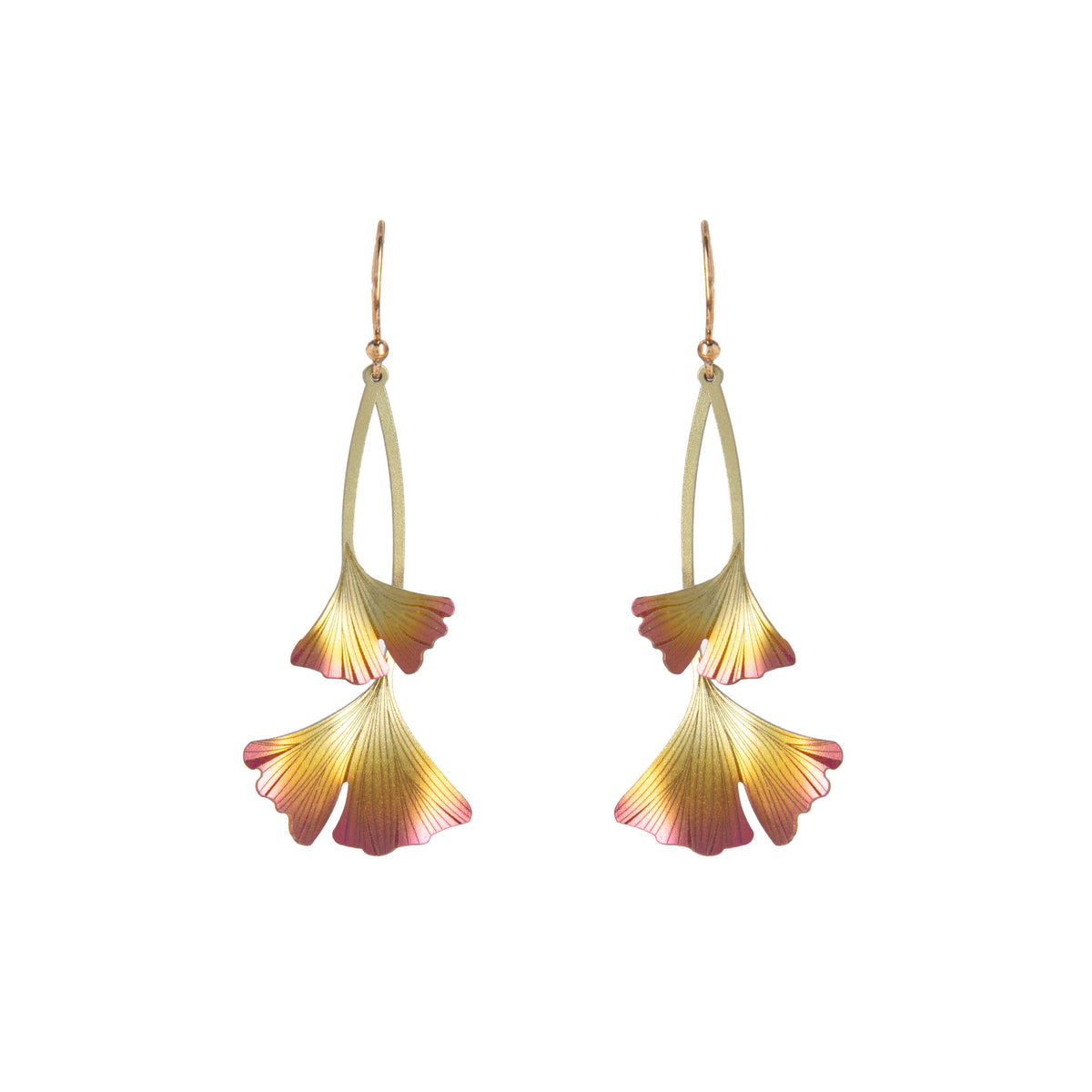 Pair of earrings with ginkgo leaf-shaped floral design on a white background