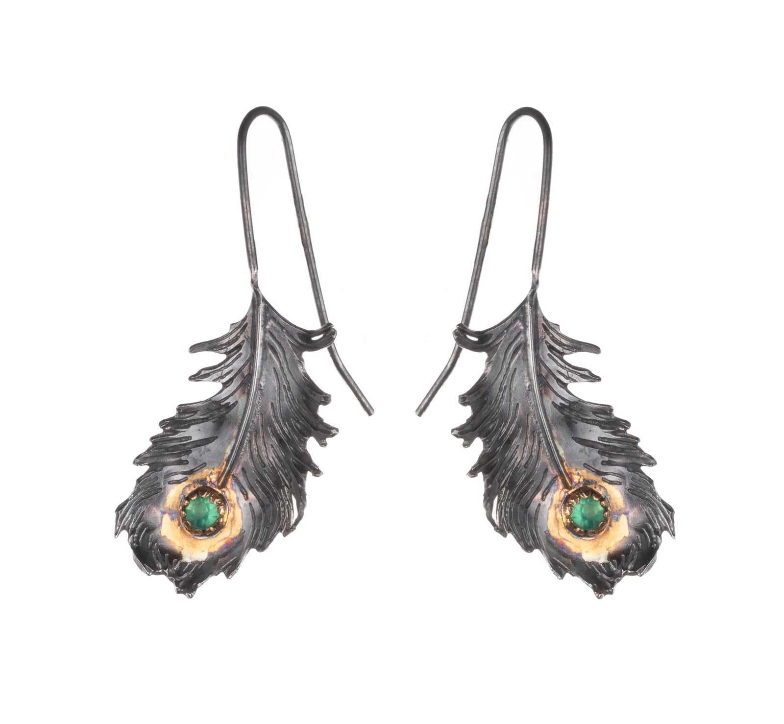 Feather-shaped earrings with green gemstones on a white background