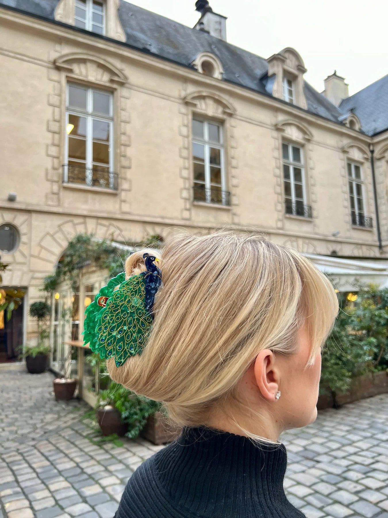 This gloriously colored and beautifully detailed peacock hair clip captures this regal bird in all its fine feathered fabulousness!  This unique hair clip is hand finished and carefully crafted from cellulose acetate, an eco-friendly, biodegradable material made from recycled wood pulp. Dimensions: 5" x 2.5".