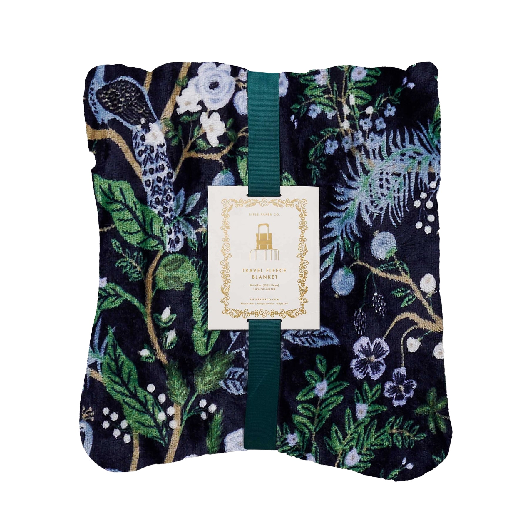 Floral-patterned travel fleece blanket with a brand label on a white background