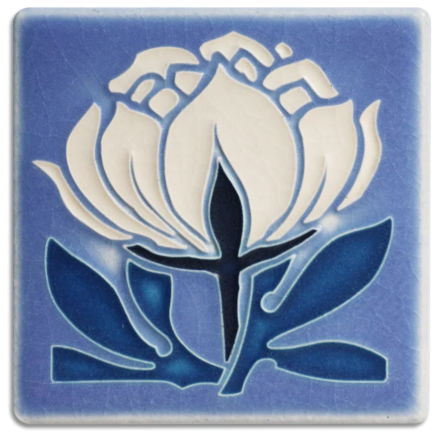 One of Nawal Motawi's favorite flowers, the peony is a recurring source of inspiration at Motawi Tileworks.  Actual Tile Size: Approximately 3 7/8” x 3 7/8”. As each Motawi tile is crafted by hand, dimensions may vary slightly by up to 1/16". Tiles are 5/8" thick and have a notch at the back for hanging. 