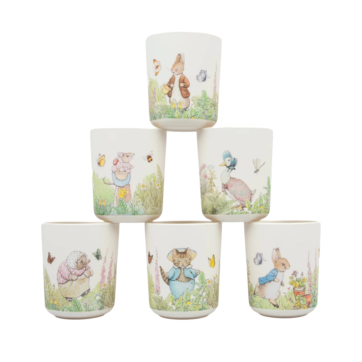 Set of six melamine cups with illustrations of Beatrix Potter's Peter Rabbit in a garden on a white background
