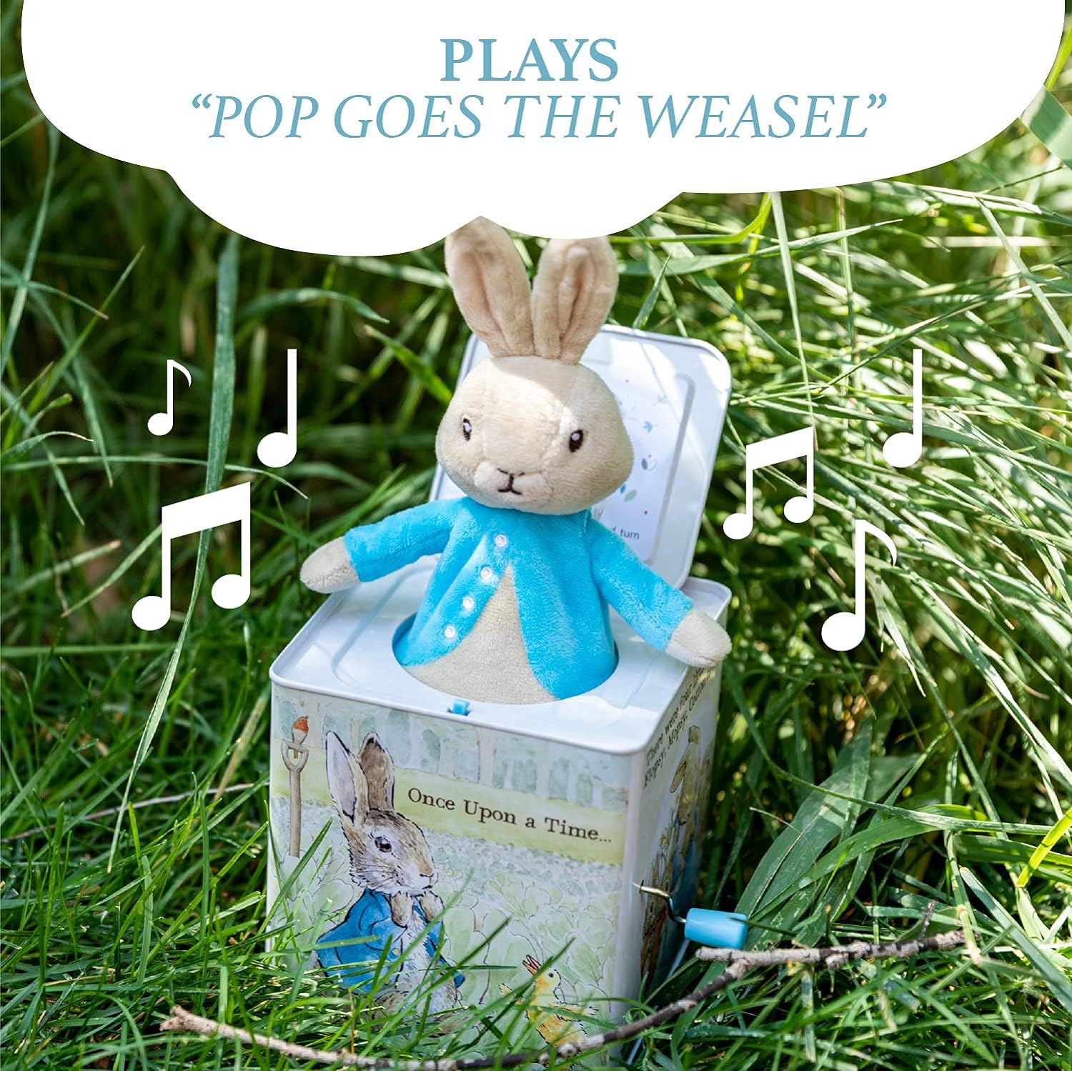 A Peter Rabbit jack-in-the-box toy with the character popped out at the top, housed inside a box decorated with illustrations from Beatrix Potter's stories.