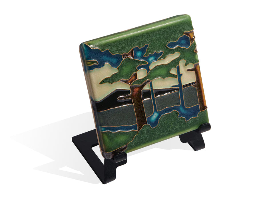 The Pine Landscape series is adapted from Grueby Faience designer Addison LeBoutillier's tile "Pines." This tile is one of the most recognized as a Motawi signature series. Each tile is made by hand in Ann Arbor, Michigan. Tiles are 5/8" thick and have a notch at the back for hanging.