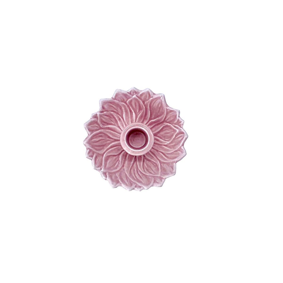 Pink decorative flower-shaped candle holder on a white background