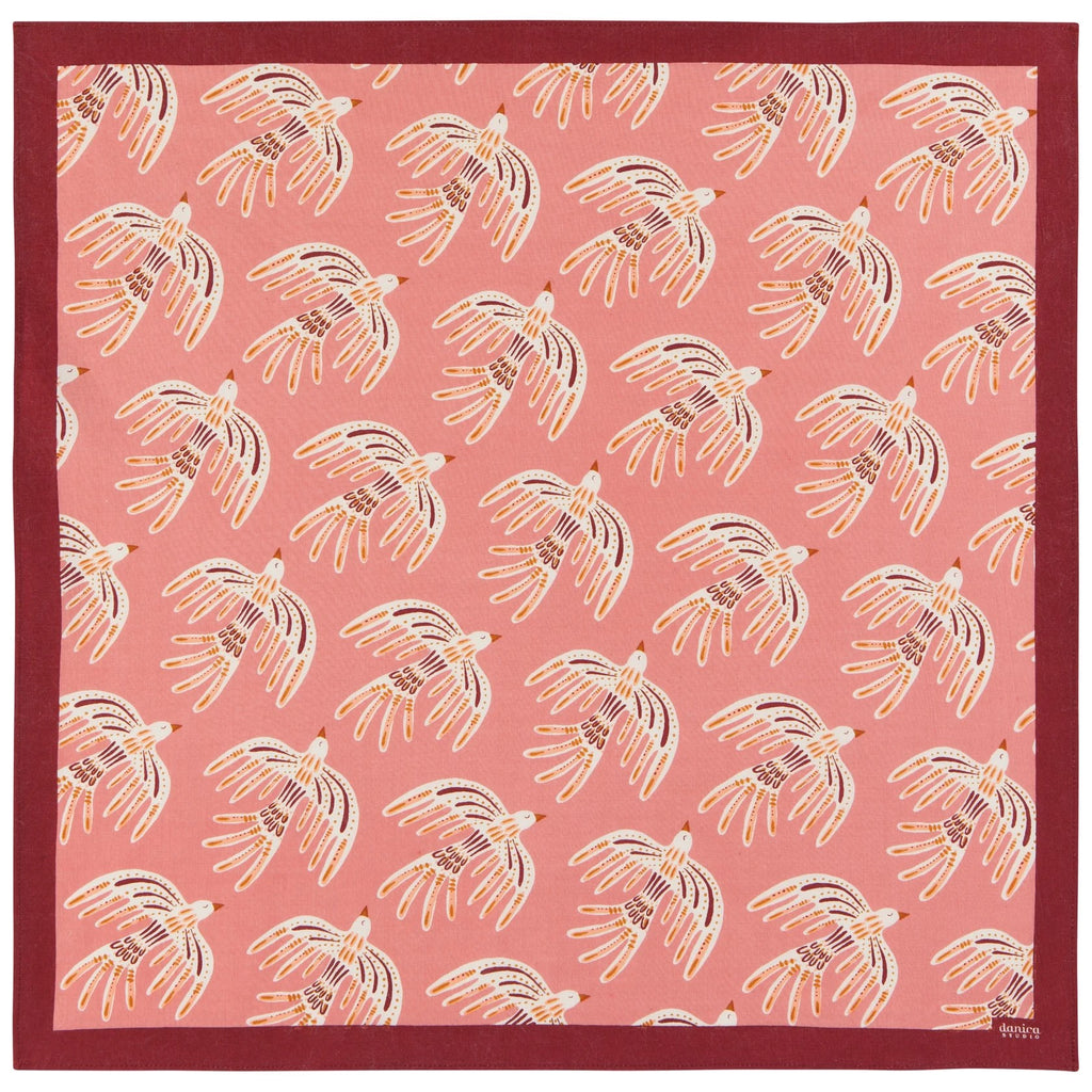 This soft cotton bandana is a unique and versatile addition to your wardrobe. Wear around your neck, wrist, as a headband, or tie to your tote. Whatever your signature style, the pretty print and flattering colors on this bandana will make this a go-to addition to many outfits. Dimensions: 21" x 21" Material: 85% Recycled Cotton, 15% Recycled Polyester Care Instructions: Machine wash cold, gentle cycle. Hang to dry.