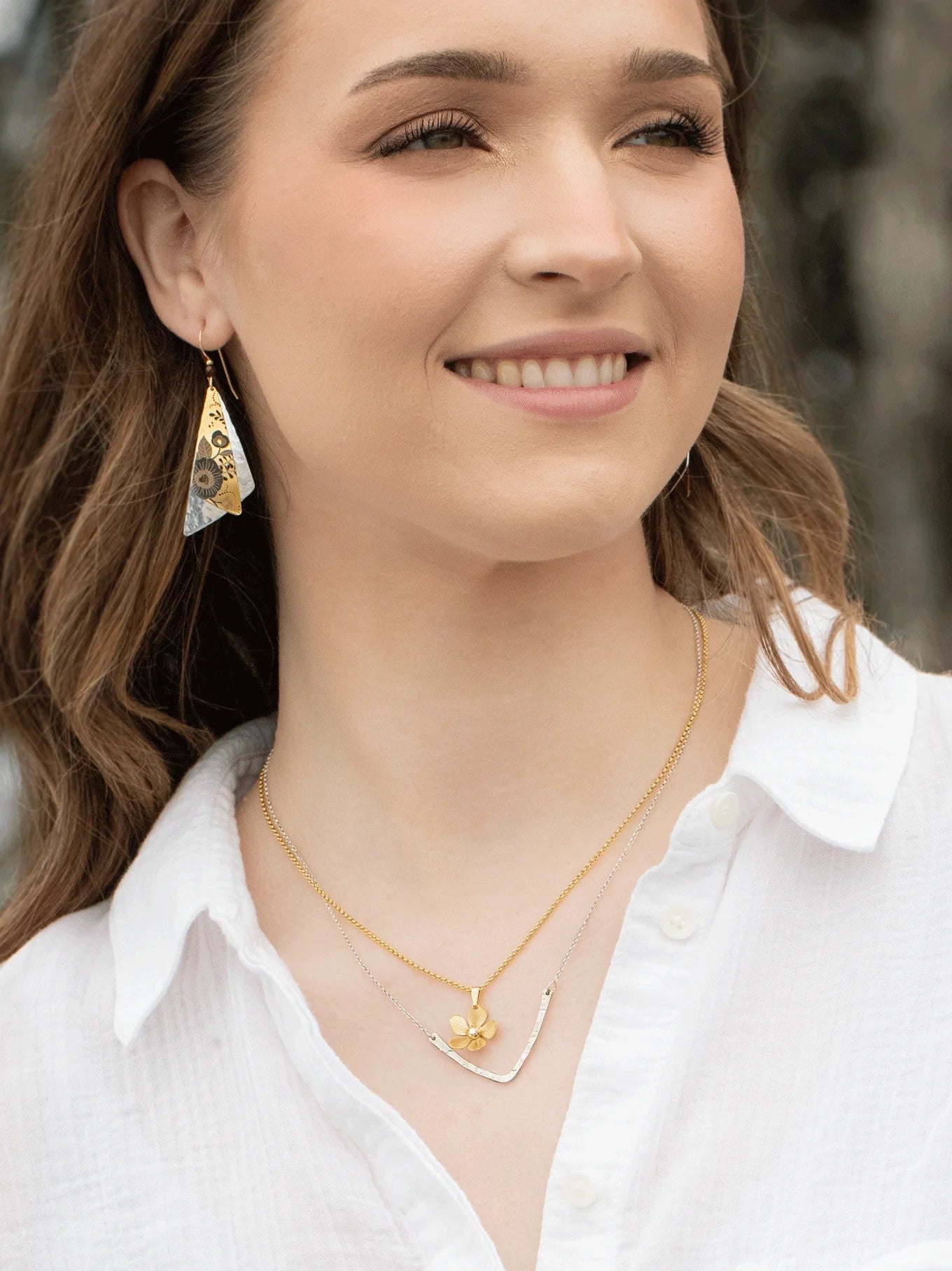 It's always a garden party with this dainty and delightful plumeria drop necklace. A single hand formed bloom with just a hint of sparkle hangs with darling feminine flair from delicate chain. Materials: 18k gold plated metal. CZ crystal. Dimensions: Adjustable 18-20"; 3/4" l. × 1/2" w. Pendant.