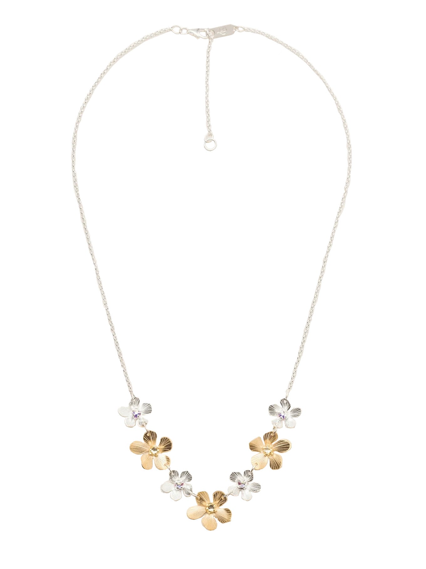 This necklace features 18k gold plated, and silver plated Plumeria flowers, each accented with a sparkling crystal stone. Materials: 18k gold plated flowers. Silver plated flowers and chain. Crystal. Dimensions: Adjustable chain - 18-20". Gold flowers: 0.5" x 0.5". Silver flowers: 0.35" x 0.35".