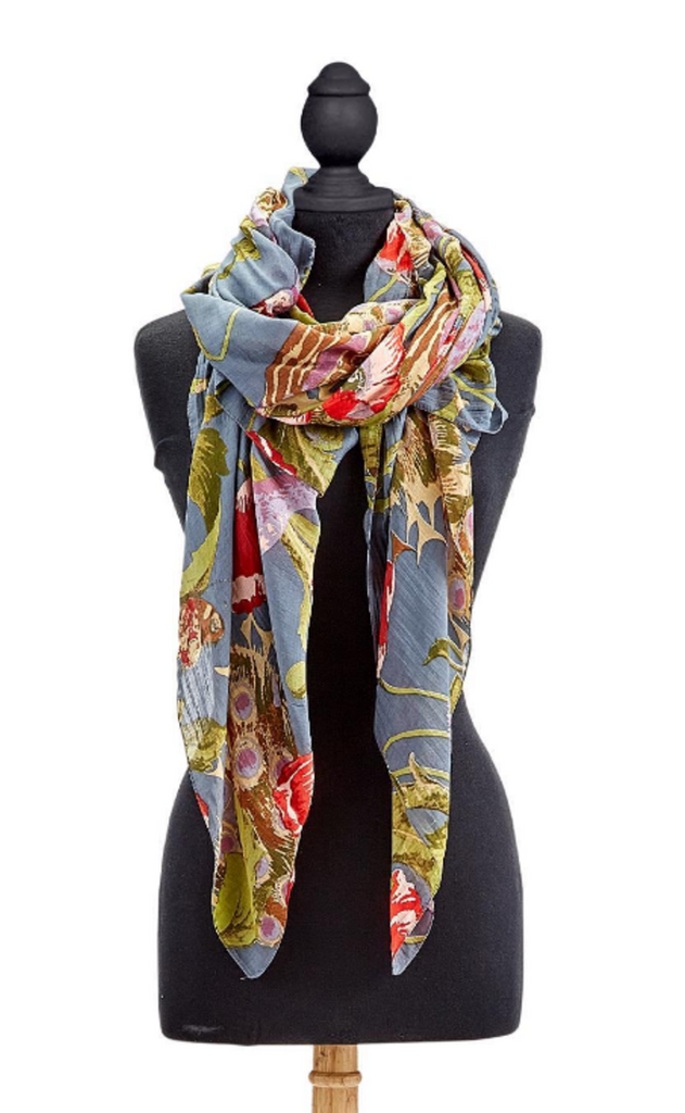 Elegant poppy flowers and colorful peacocks are detailed in this pattern over a blue-grey background. This scarf is made from a silk- like lightweight fabric blend. Lightweight and Super Soft. Made from a Custom Blend of 50% Modal and 50% Viscose. Measures 40" W x 78" L. Hand Wash Cold.