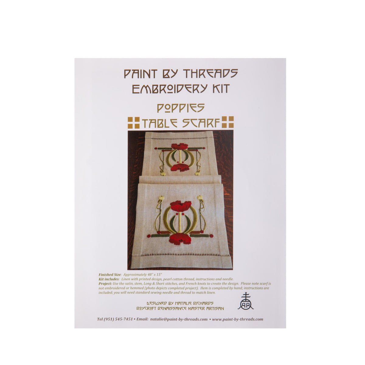 Embroidery kit packaging with a table scarf design featuring poppies on a white background.
