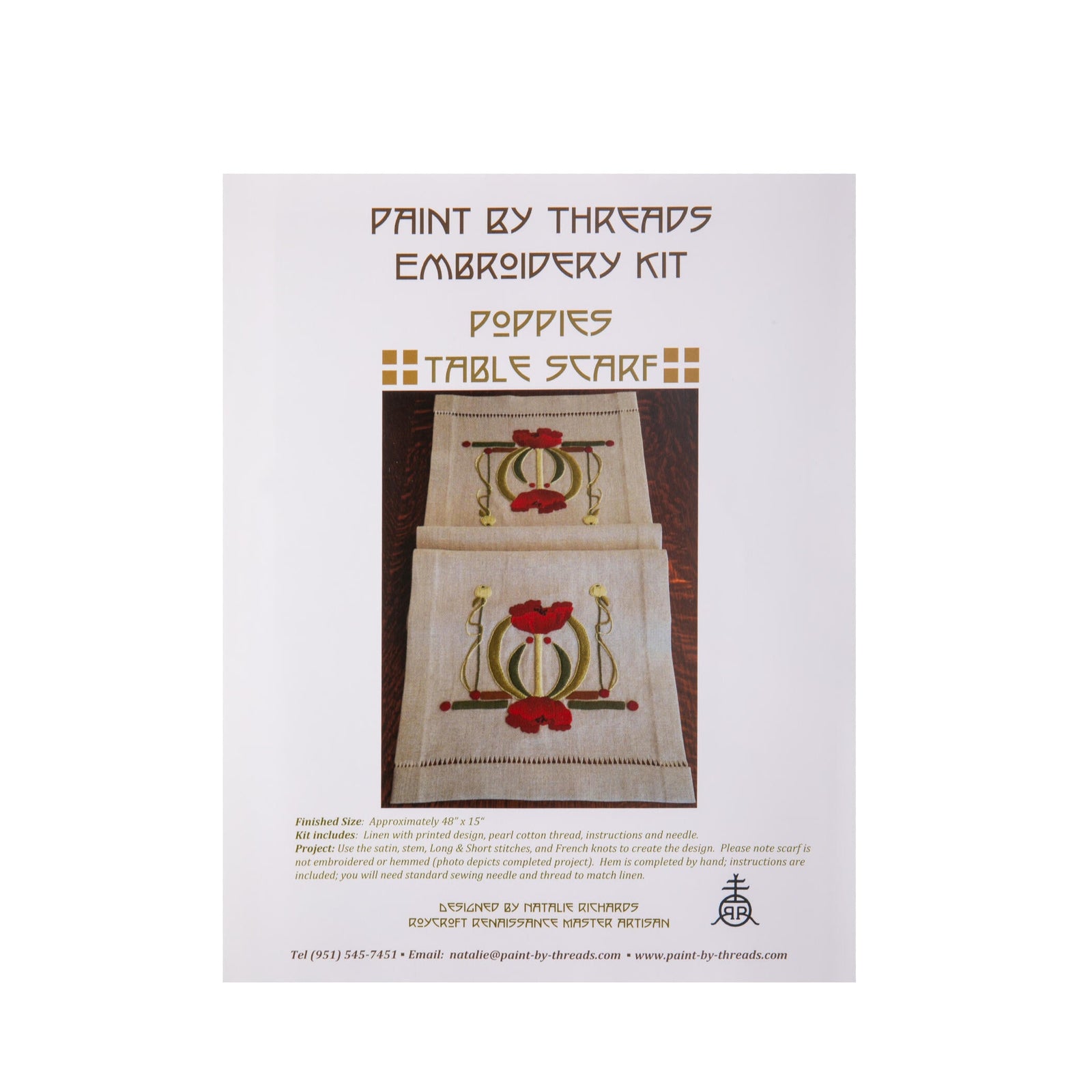Embroidery kit packaging with a table scarf design featuring poppies on a white background.
