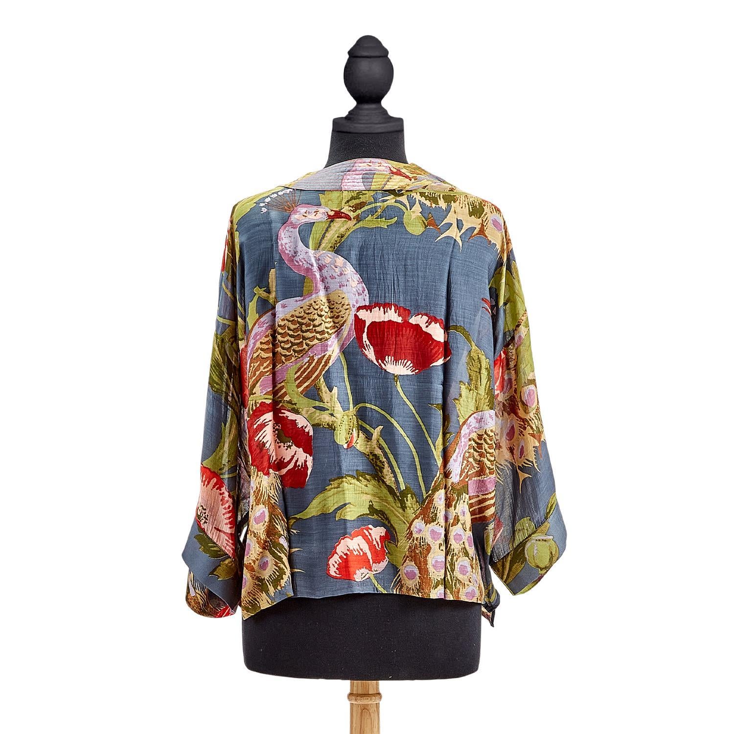 Colorful floral kimono-style jacket on a mannequin against a white background
