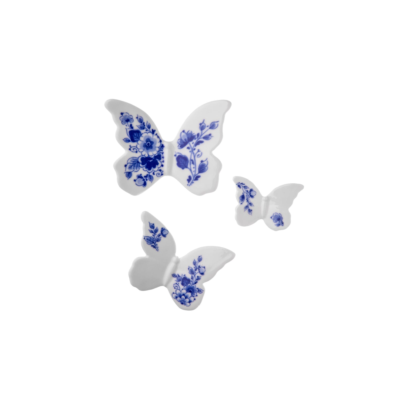 Three white porcelain wall decor butterflies with blue floral patterns on a white background