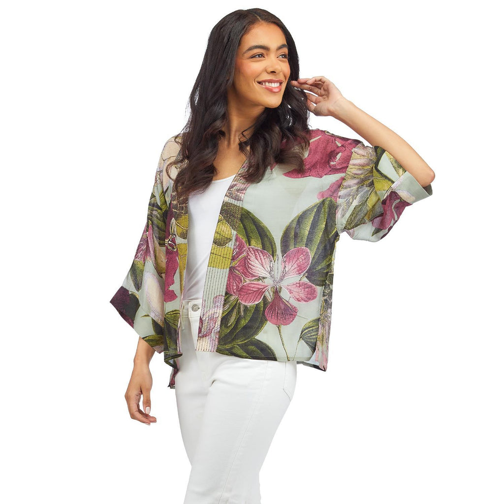 Beautiful Protea blooms on a robin-egg blue base adorn this soft, silk-like short kimono. This loose-fitting kimono style jacket has ¾ length sleeves, an open front and a lightly embroidered lapel. Made from a super soft and light, eco-friendly sustainable modal/cupro blend. One Size Fits Most. 50% modal & 50% viscose.