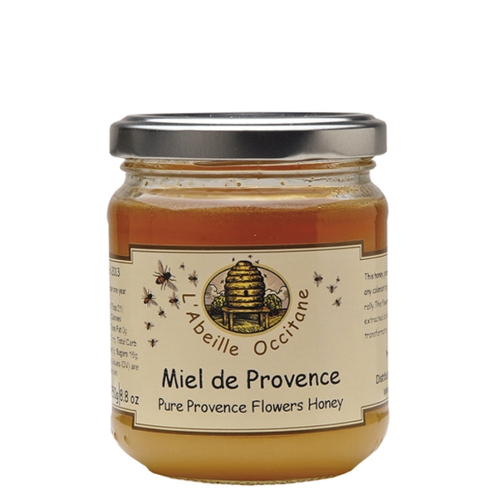 Harvested in traditional ways in the Provence region of France, this Provence Flowers Honey is a delightful combination of floral and honey flavors. 100% natural, this honey is created by the bees feeding on various Provence flowers, giving it complex floral notes and a creamy texture. Made in France 8.8oz glass jar.