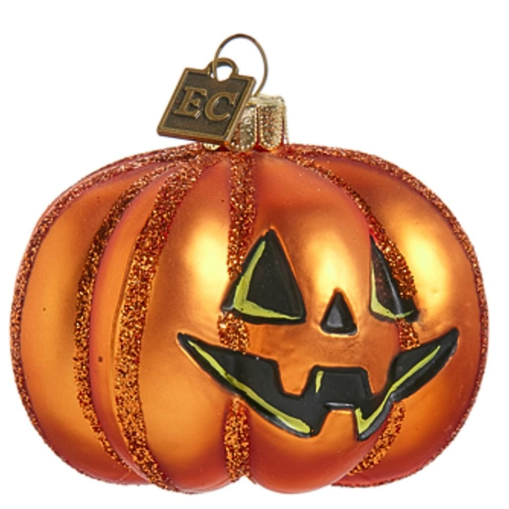 Add a festive touch to your Halloween décor with this sparkling pumpkin ornament. Featuring a classic jack-o'-lantern design with glittery orange details, this charming ornament is perfect for any Halloween setting. Hand finished glass ornament. Dimensions: 2.5" x 3".