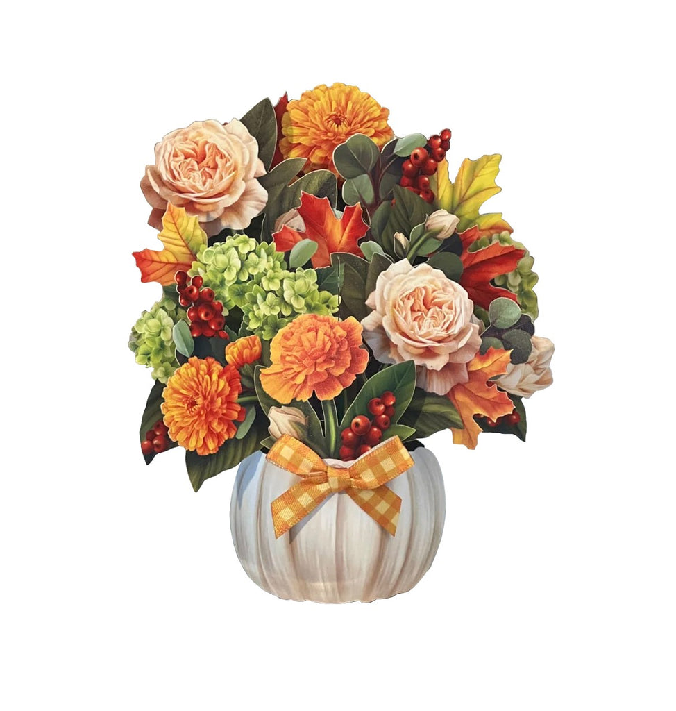 It's pumpkin spice season! Enjoy the cinnamon shades of fall all year long with this Pumpkin Spice paper bouquet. Meticulously designed marigolds, garden roses, green hydrangeas, eucalyptus, red berries, and maple leaves blossom in a white pumpkin vase with a gingham bow. Pop-up greeting card. 5.5" x 5".