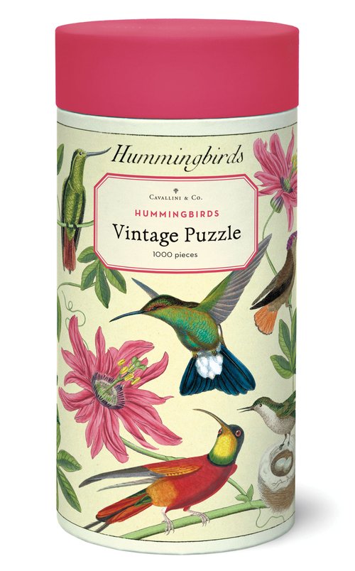 The perfect rainy-day activity! Enjoy assembling this colorful, 1000-piece hummingbird puzzle, designed using vintage illustrations and packaged in a handy, decorated storage tube. Also includes a hand-stitched muslin bag to keep the puzzle pieces in. 1000-piece puzzle. Finished puzzle measures 20" x 28".