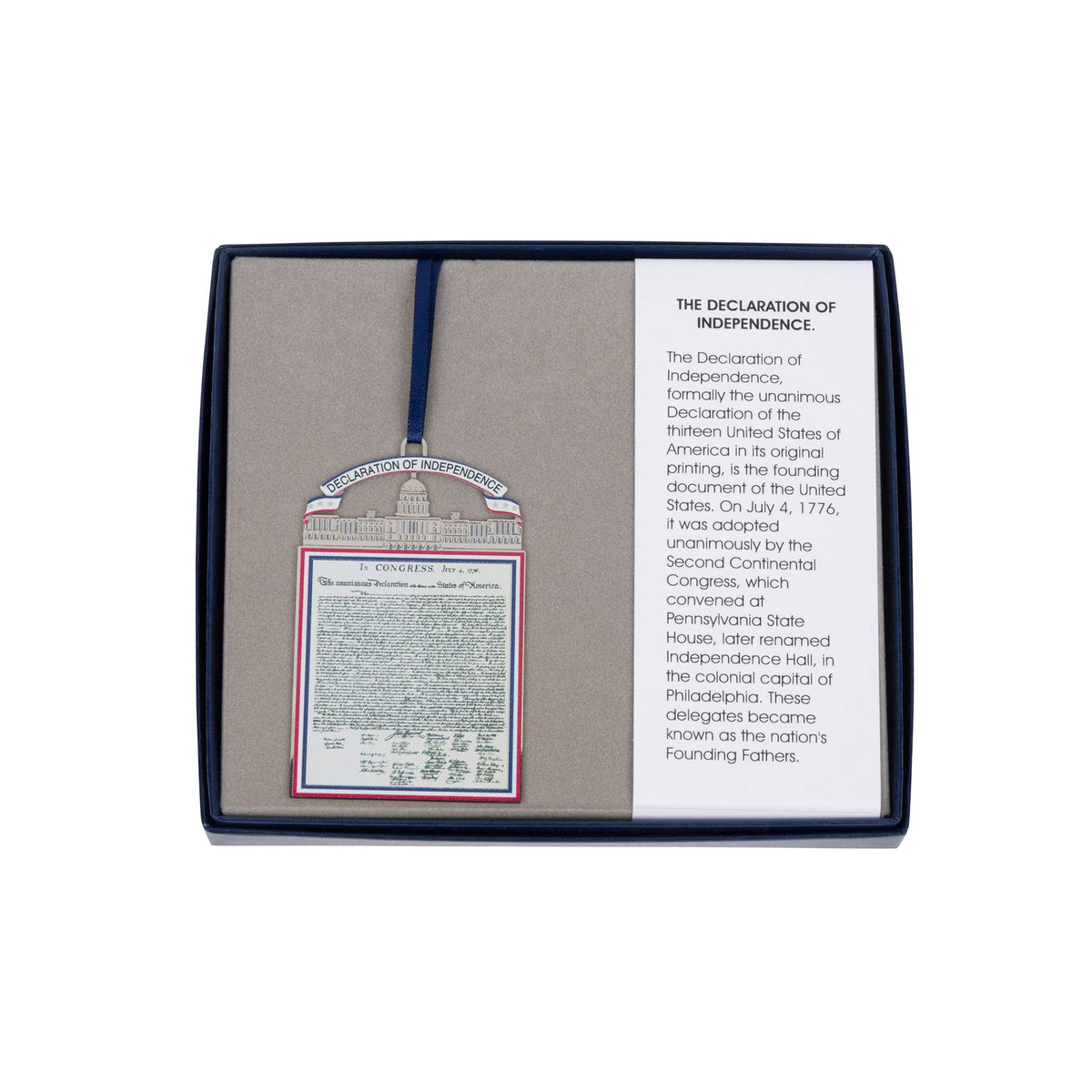 Decorative item with text and a small flag on a white background