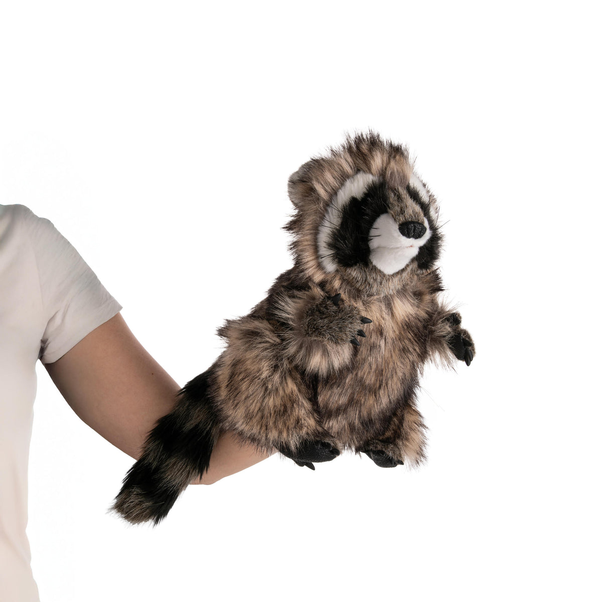 Plush raccoon toy hand puppet held in a hand against a white background