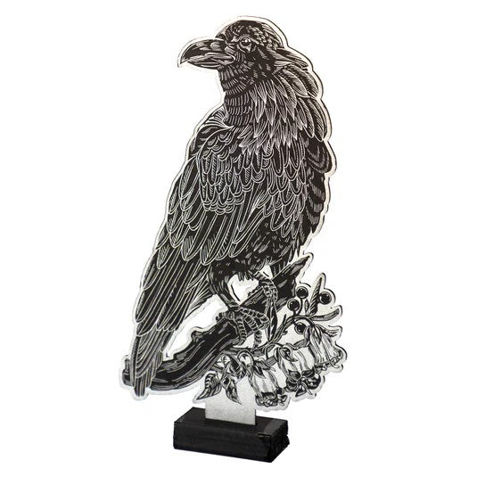 Metallic bird sculpture on a white background