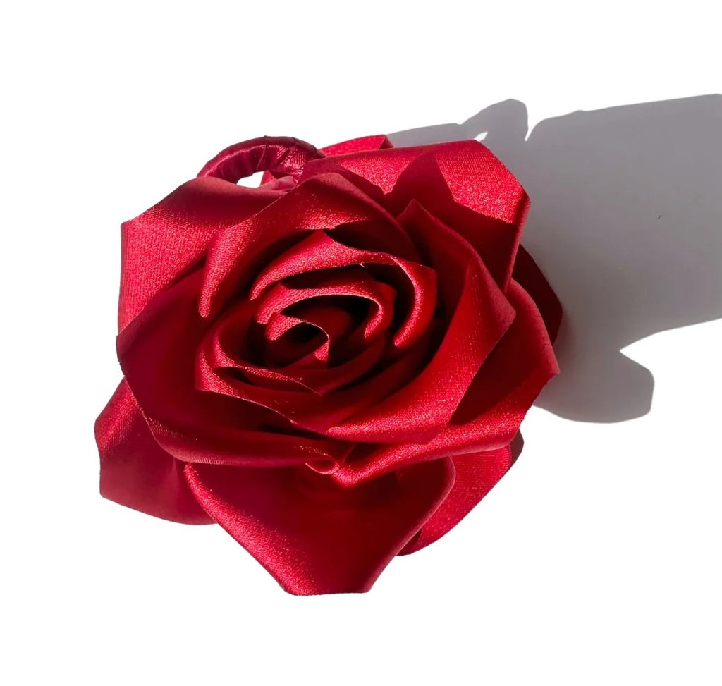 This satin rose claw hair clip is carefully made by hand. Each claw features two roses for a romantic look from all angles.