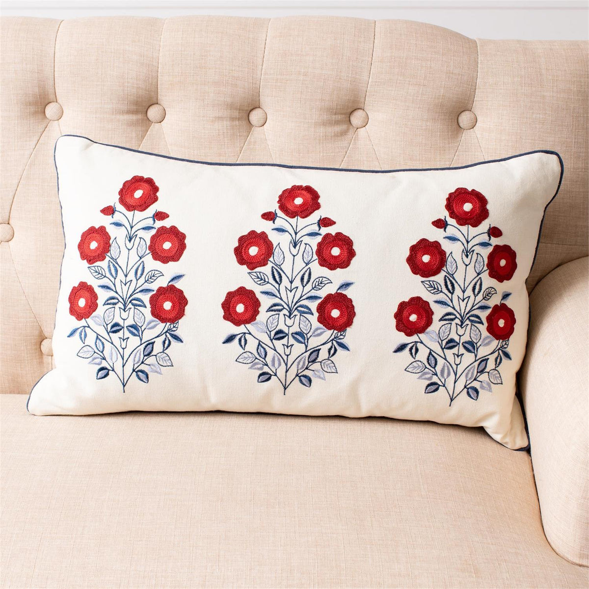 Decorative pillow with floral pattern on a beige couch