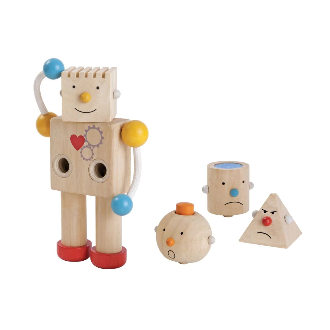 This charming robot features four interchangeable heads, which teach emotions and offers different tactile &amp; auditory experiences. Legs are movable for standing or sitting.  Sustainably made. Dimensions: 4.72 in X 2.6 in X 7.87 in Age: 3 years +