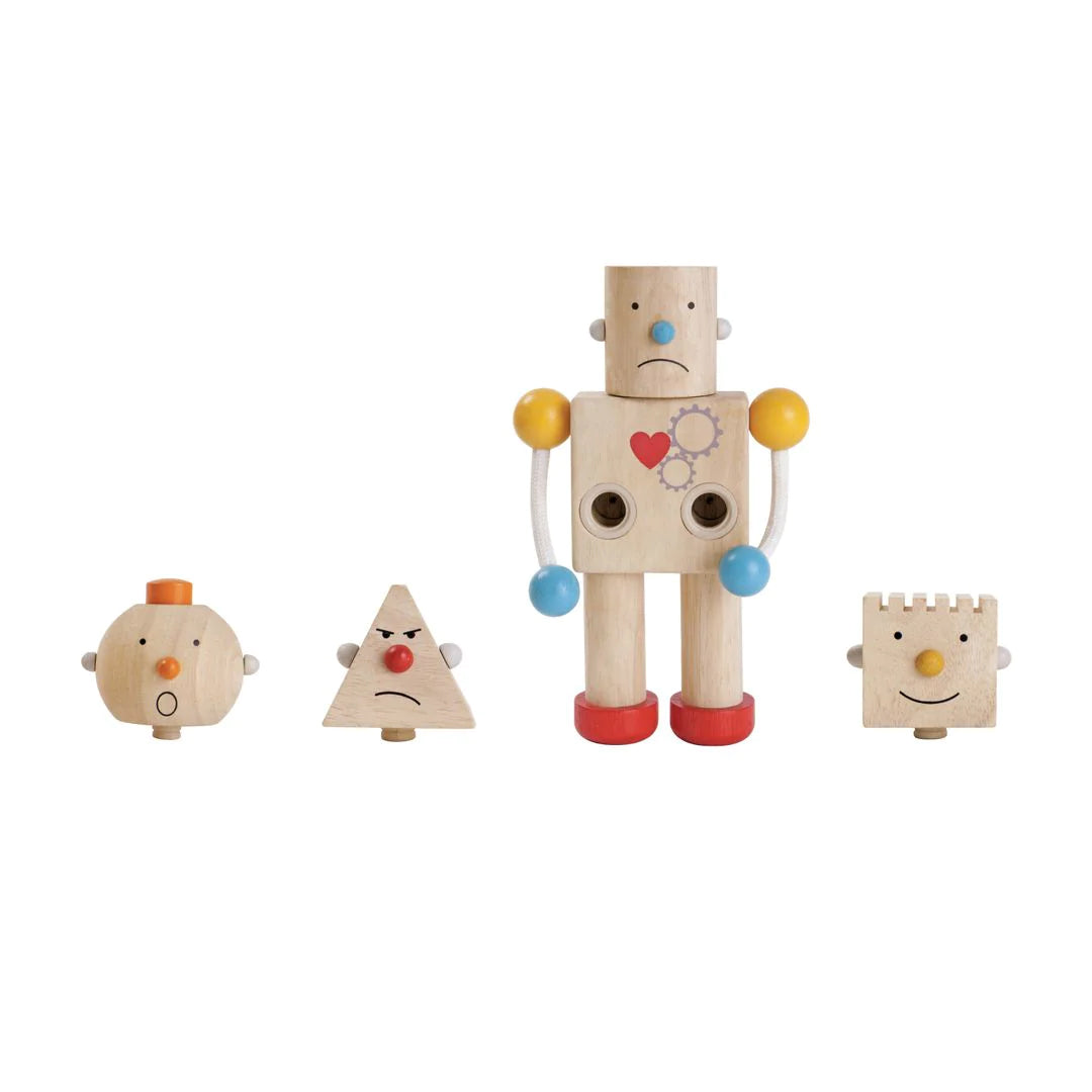 This charming robot features four interchangeable heads, which teach emotions and offers different tactile & auditory experiences. Legs are movable for standing or sitting.  Sustainably made. Dimensions: 4.72 in X 2.6 in X 7.87 in Age: 3 years +