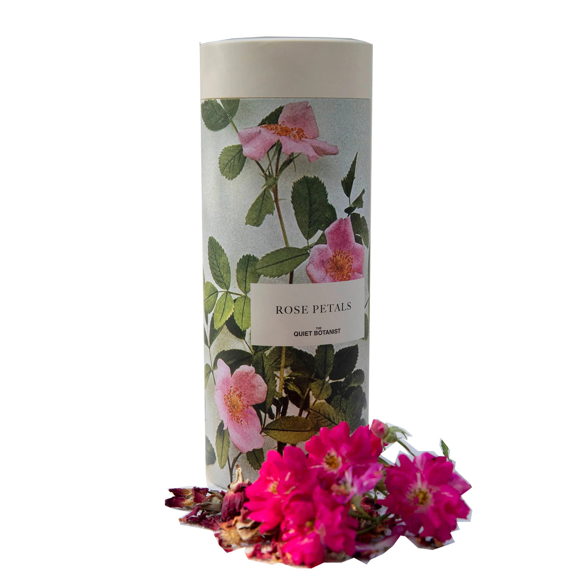 Cylindrical product packaging with floral design and 'Rose Petals' text, accompanied by pink flowers on a white background.