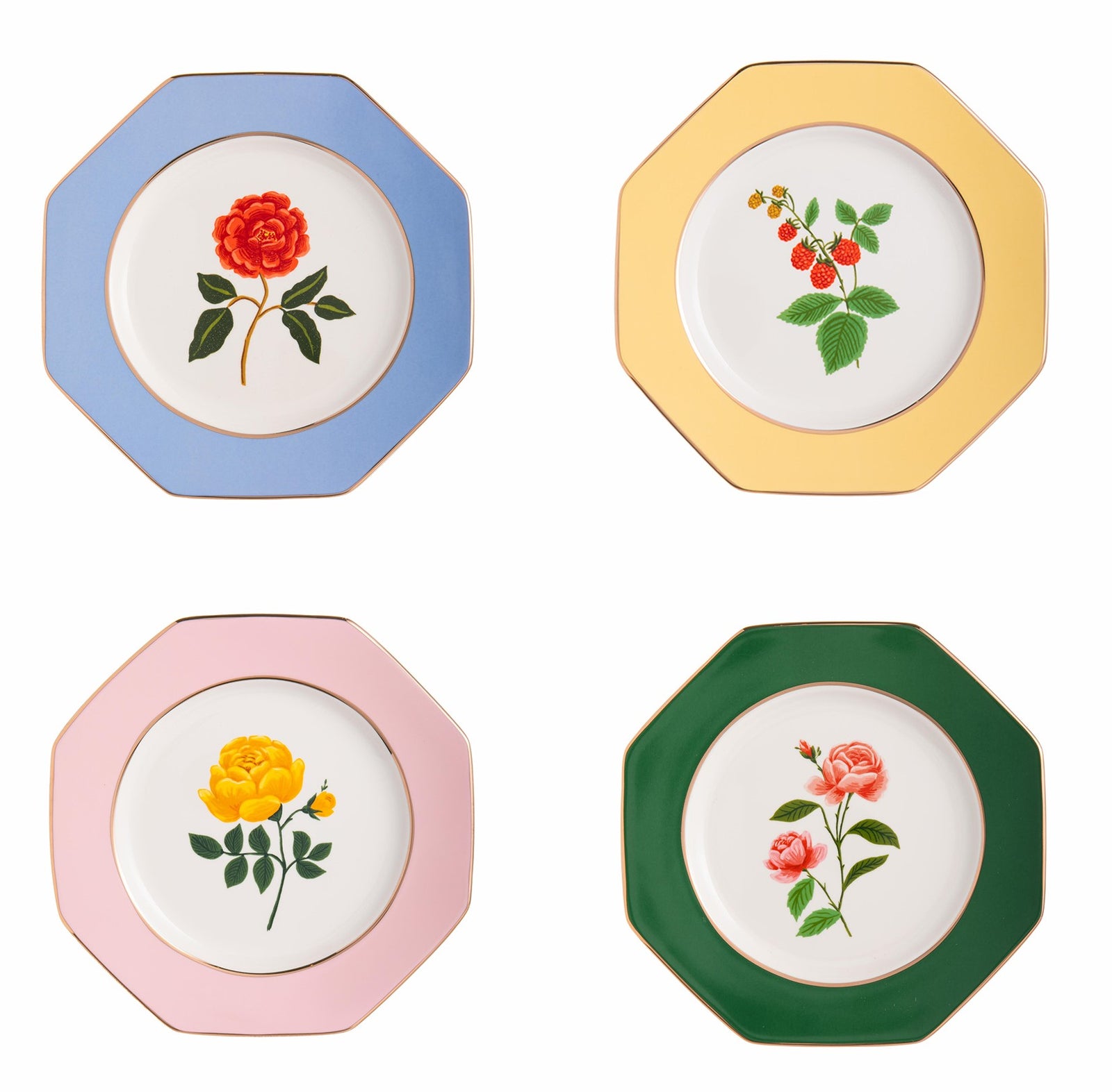 Set of floral ceramic plates with matching box on a white background