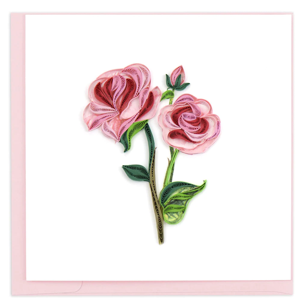 Pink Roses represent grace, gentleness, admiration and happiness making this the perfect card to send to your loved one. Features two blooming pink roses and one bud from a long green stem with leaves. This card is handmade and takes one hour to create. 6" x 6". Includes pink envelope. Fair Trade production.