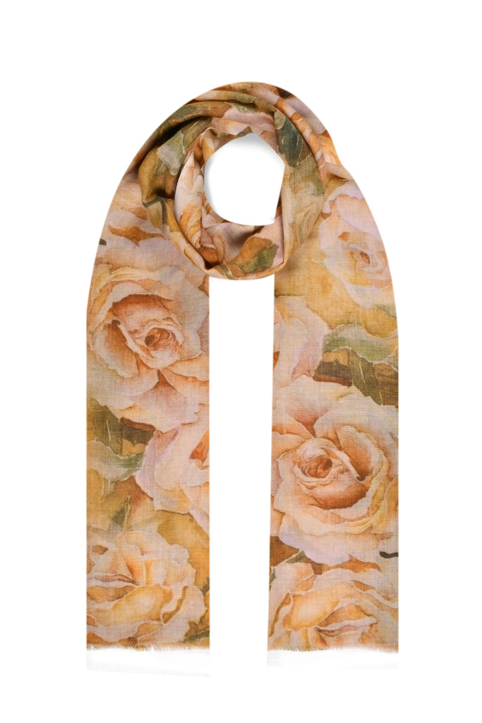 Beautifully soft, this charming stole-sized scarf features cascade of yellow and cream roses, printed charmingly on a wool silk wrap. This is a great wrap to wear day to night, and is lightweight enough to tuck into your purse to keep the chill off on summer evenings. 70X200 cm. 100% Merino wool.