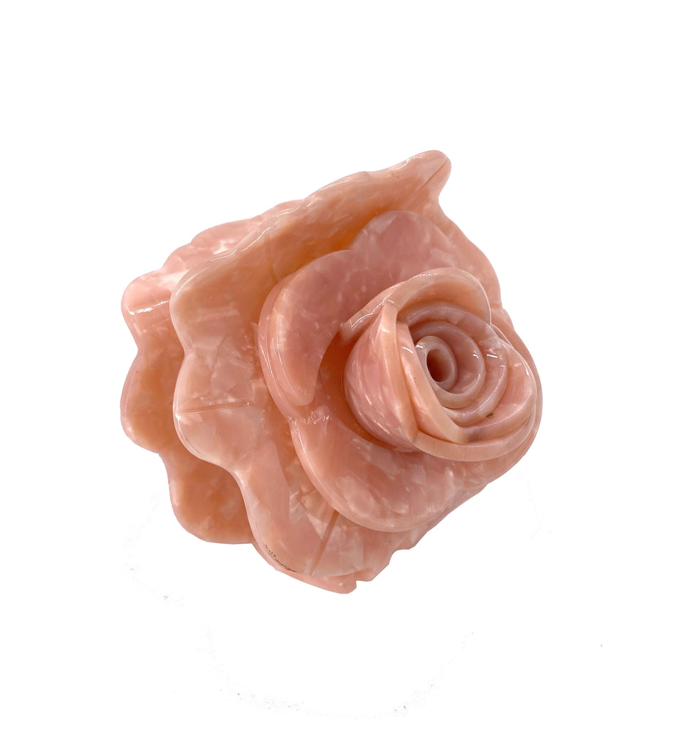 This origami rose hair clip has a layered, 3D construction, truly capturing the essence of a beautiful rose in full bloom. These unique hair clips are carefully crafted from cellulose acetate, an eco-friendly, biodegradable material made from recycled wood pulp. Dimensions: 3" x 3.5". Eco-friendly cellulose acetate.