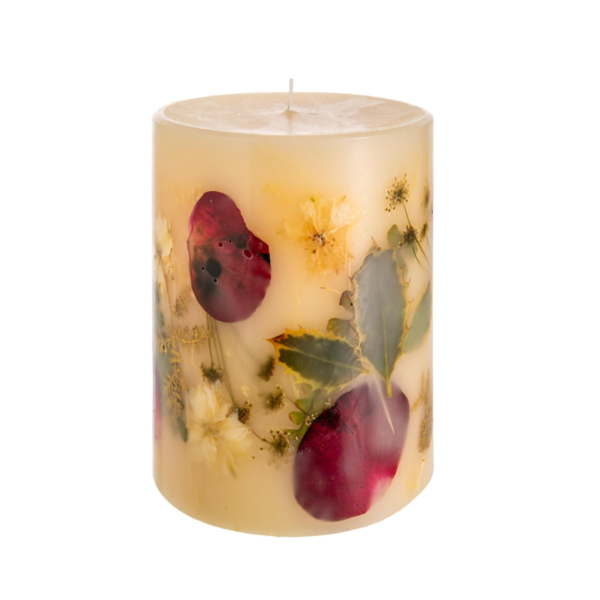 Decorative candle with floral and fruit design on a white background
