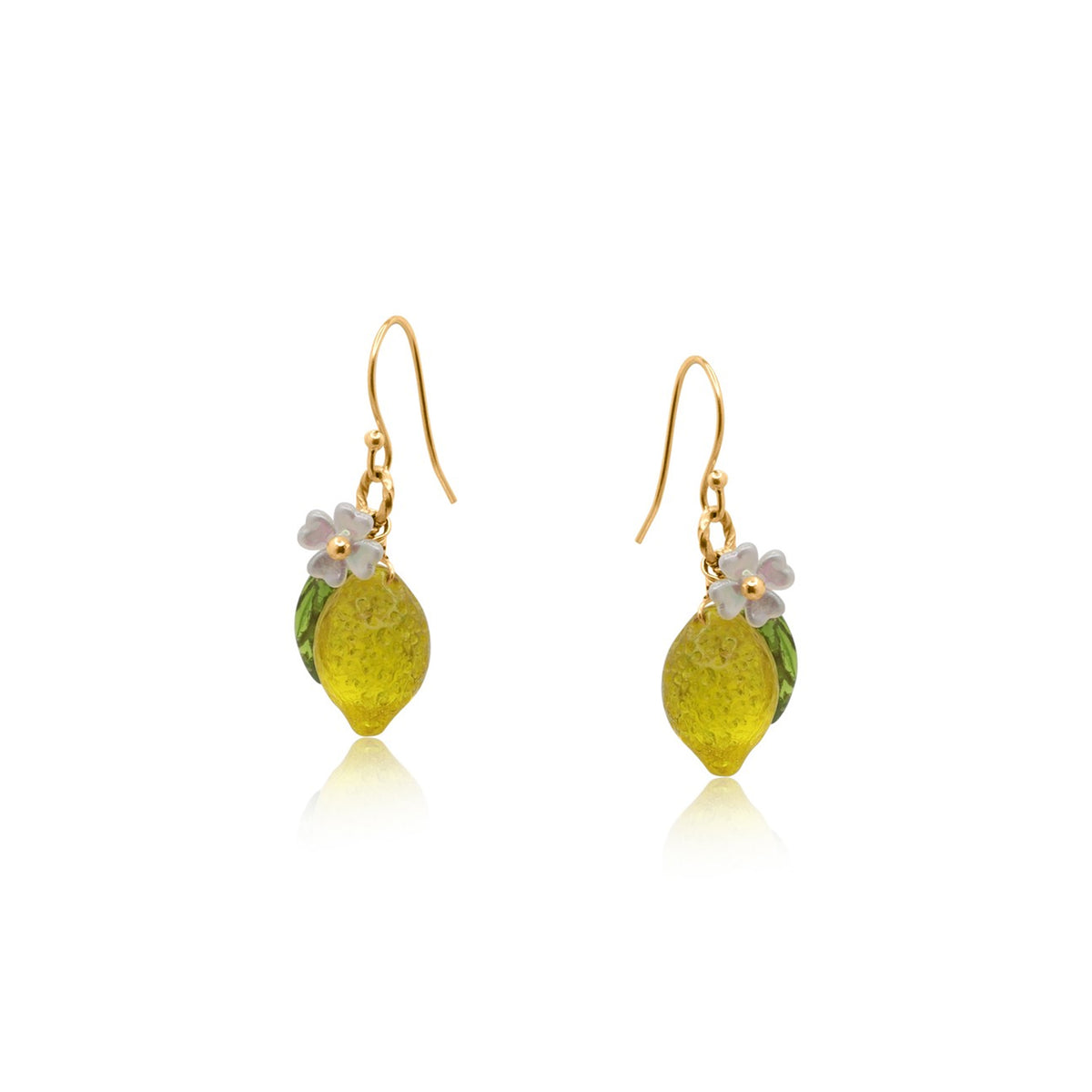 Gold earrings with yellow lemon drops and floral elements on a white background