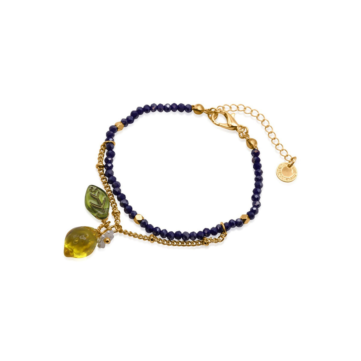 A delicate gold chain bracelet featuring a double-strand navy blue beaded section, a small gold charm, and a lemon-shaped pendant with a green leaf.