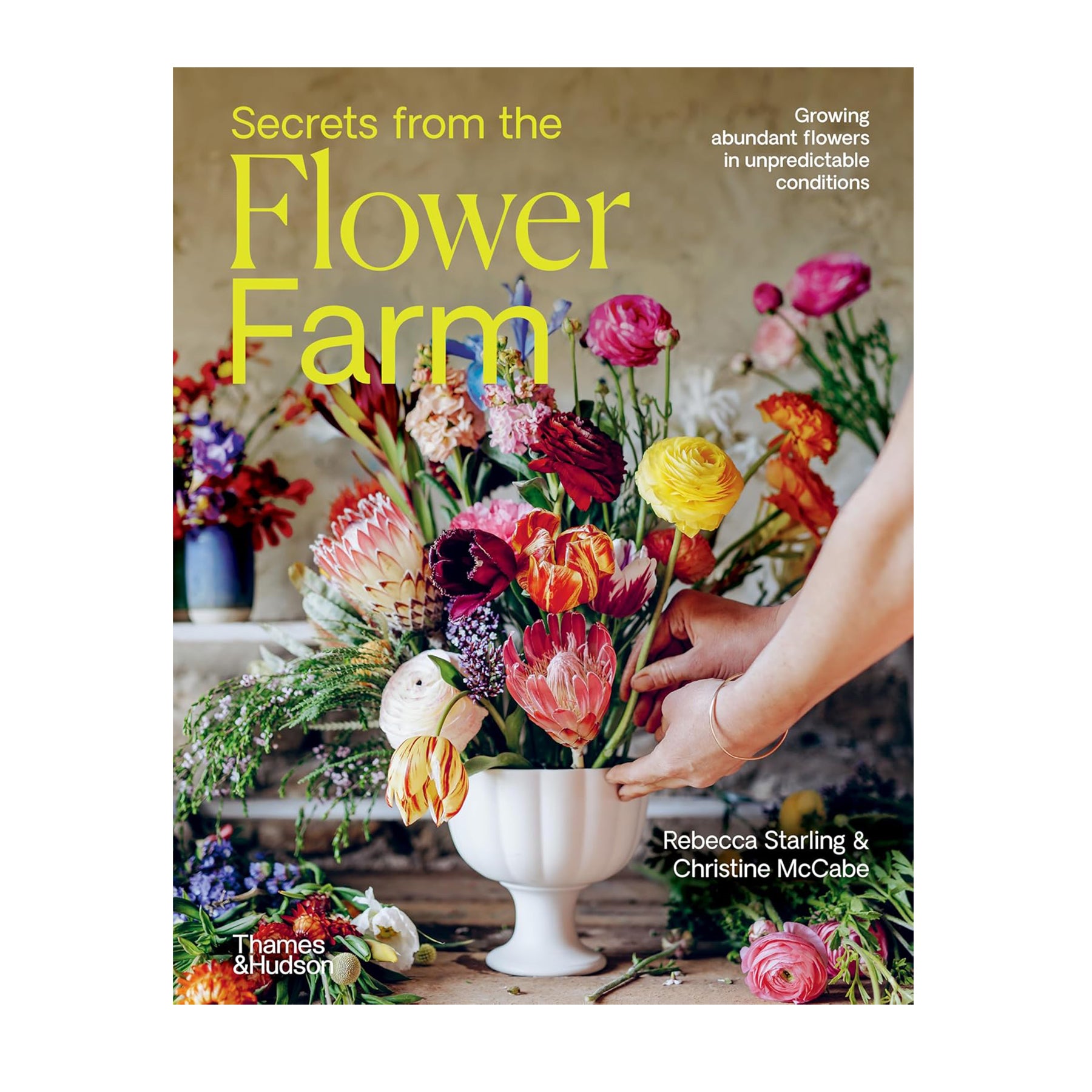 Book cover of 'Secrets from the Flower Farm' with a hand arranging flowers.