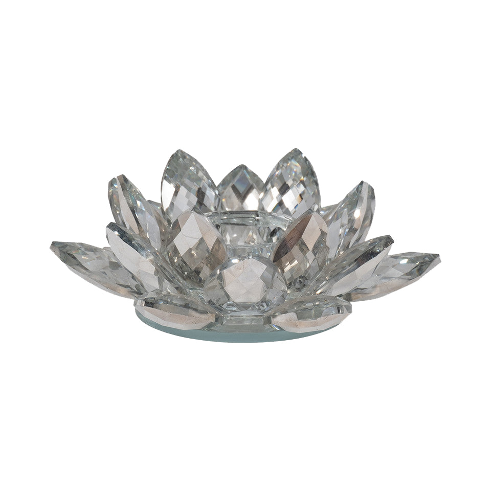 Add a touch of stunning sparkle to your table setting with this silver crystal, lotus-flower tealight holder. This fine crystal holder has multiple faceted crystal 'petals' and a mirror-like finish, making your tealight candles shine that much brighter! Fine crystal tealight holder Dimensions: 6" x 6" x 2"