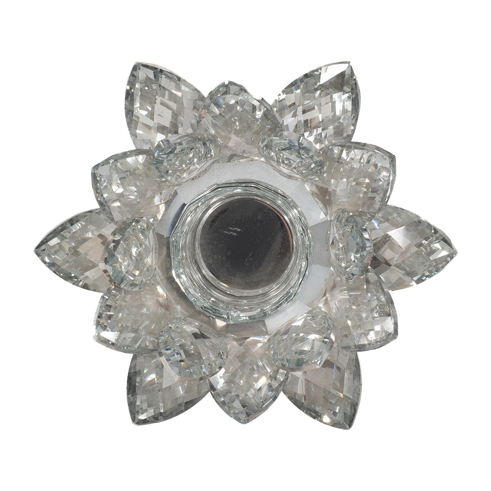 Add a touch of stunning sparkle to your table setting with this silver crystal, lotus-flower tealight holder. This fine crystal holder has multiple faceted crystal 'petals' and a mirror-like finish, making your tealight candles shine that much brighter! Fine crystal tealight holder Dimensions: 6" x 6" x 2"
