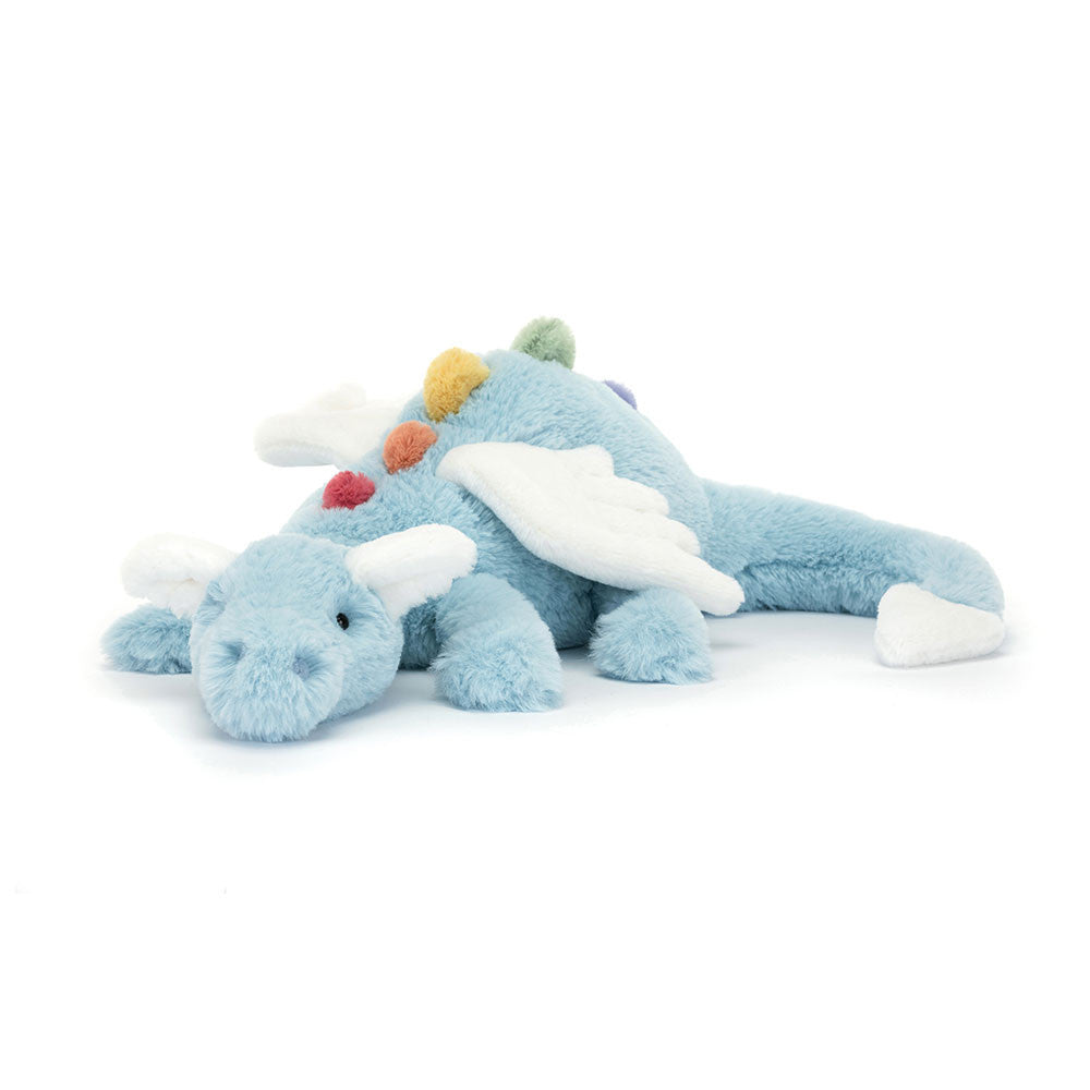 Prepare to be dazzled as Sky Dragon comes in to land! This magical friend has a long sky-blue body and soft rainbow spines from back to tail! With a cuddly snout, bobble nostrils and cloud-white wings, ears and tail dart, this sleepy dragon is an absolute dream. Dimensions: 4.7in x 5.5in x 19.7in. Suitable from birth.