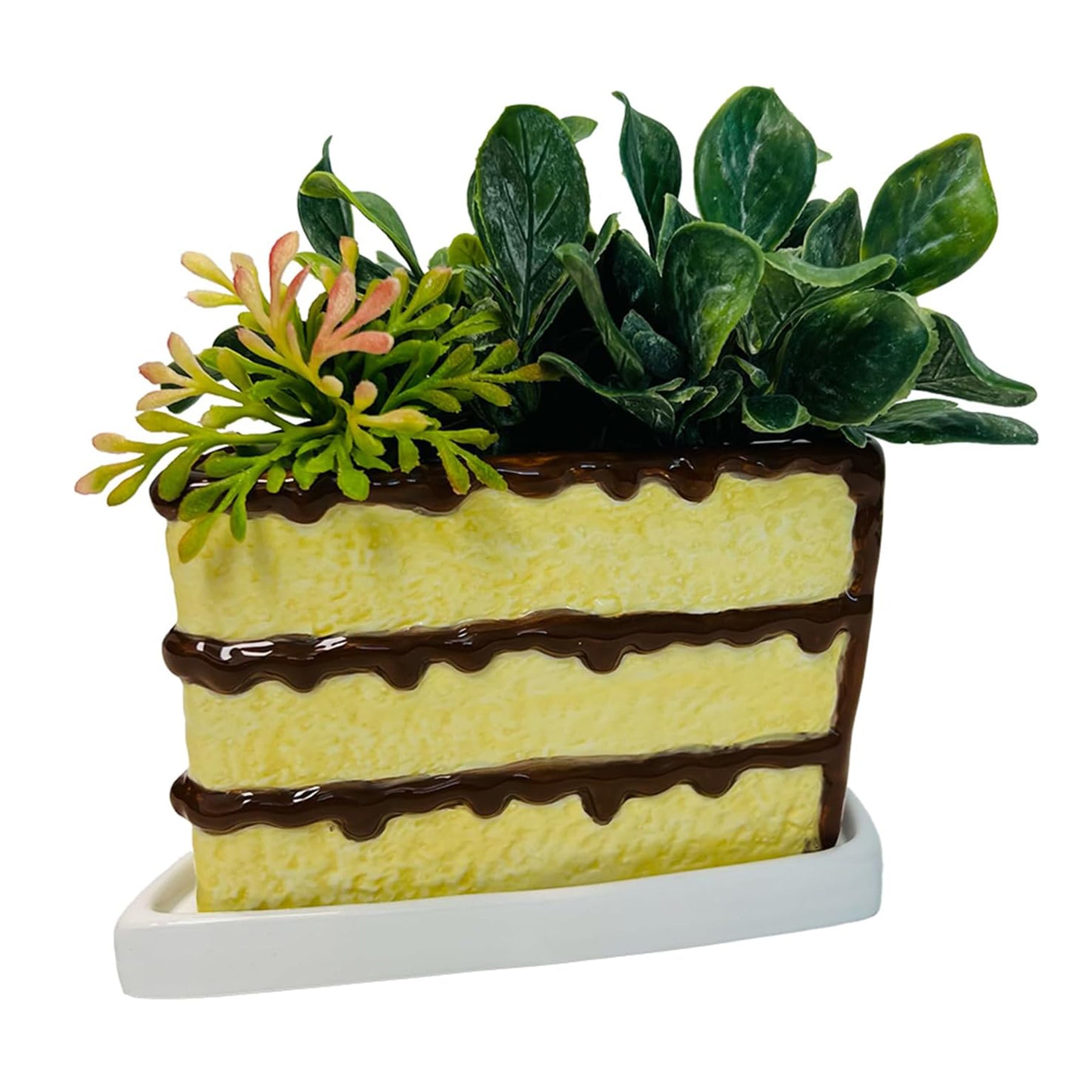 This charming planter, shaped like a slice of cake, will add a touch of fun and creativity to any space. Its vibrant colors and realistic detail make it a deliciously joyful home for your favorite plant, kitchen herbs, or miniature succulent garden. Material: ceramic Dimensions: 6.5" x 6.3" x 4" Indoor use only