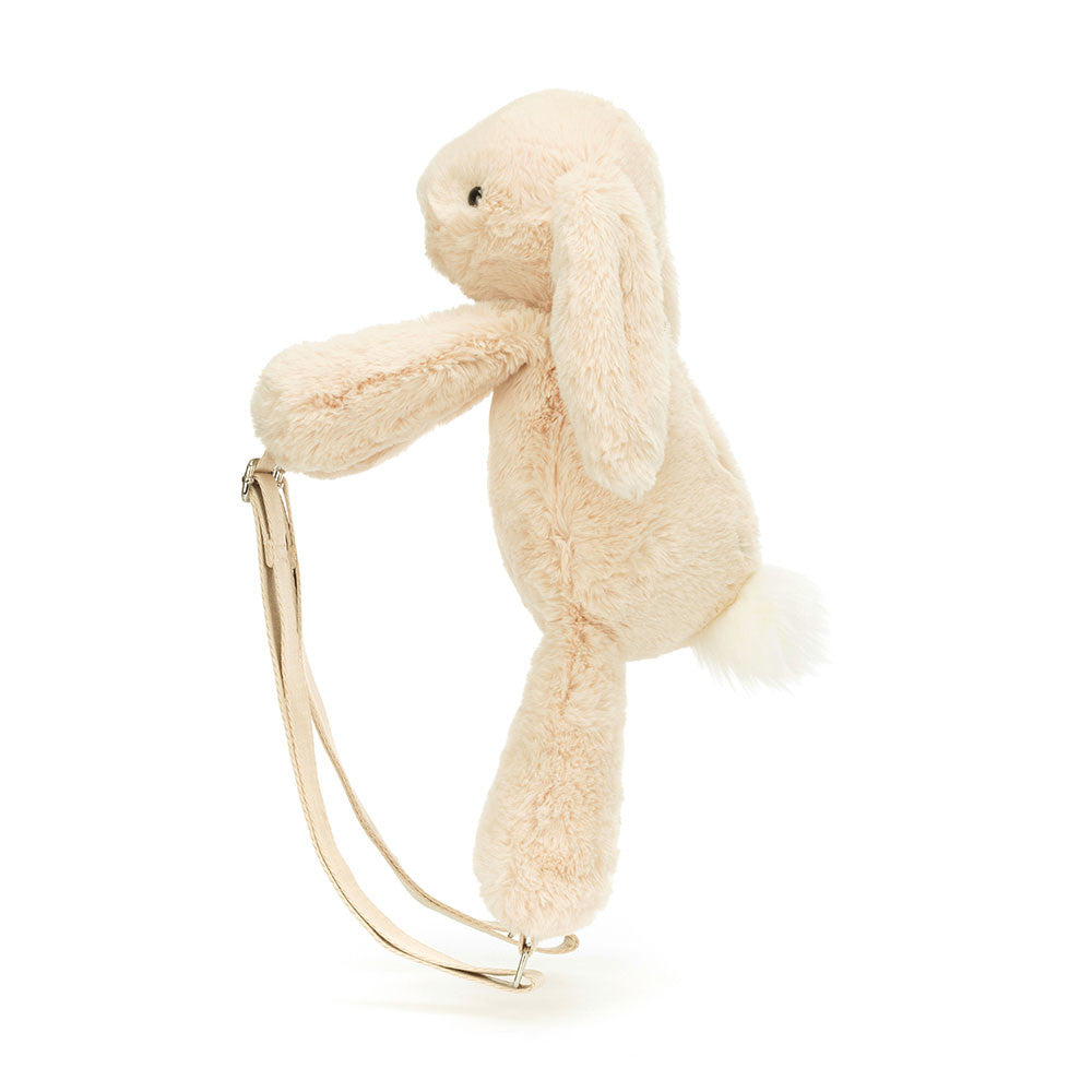 Wherever you bounce, take everything you need in the Smudge Rabbit Backpack. Soothing and soft in oatmeal fur, with a snowy bobtail and long lop-ears. With adjustable straps in strong beige webbing, this bunny's a travel essential. Dimensions: 16.9" x 6.3" x 4.7", Strap Length: 23". Suitable for 36 months plus.