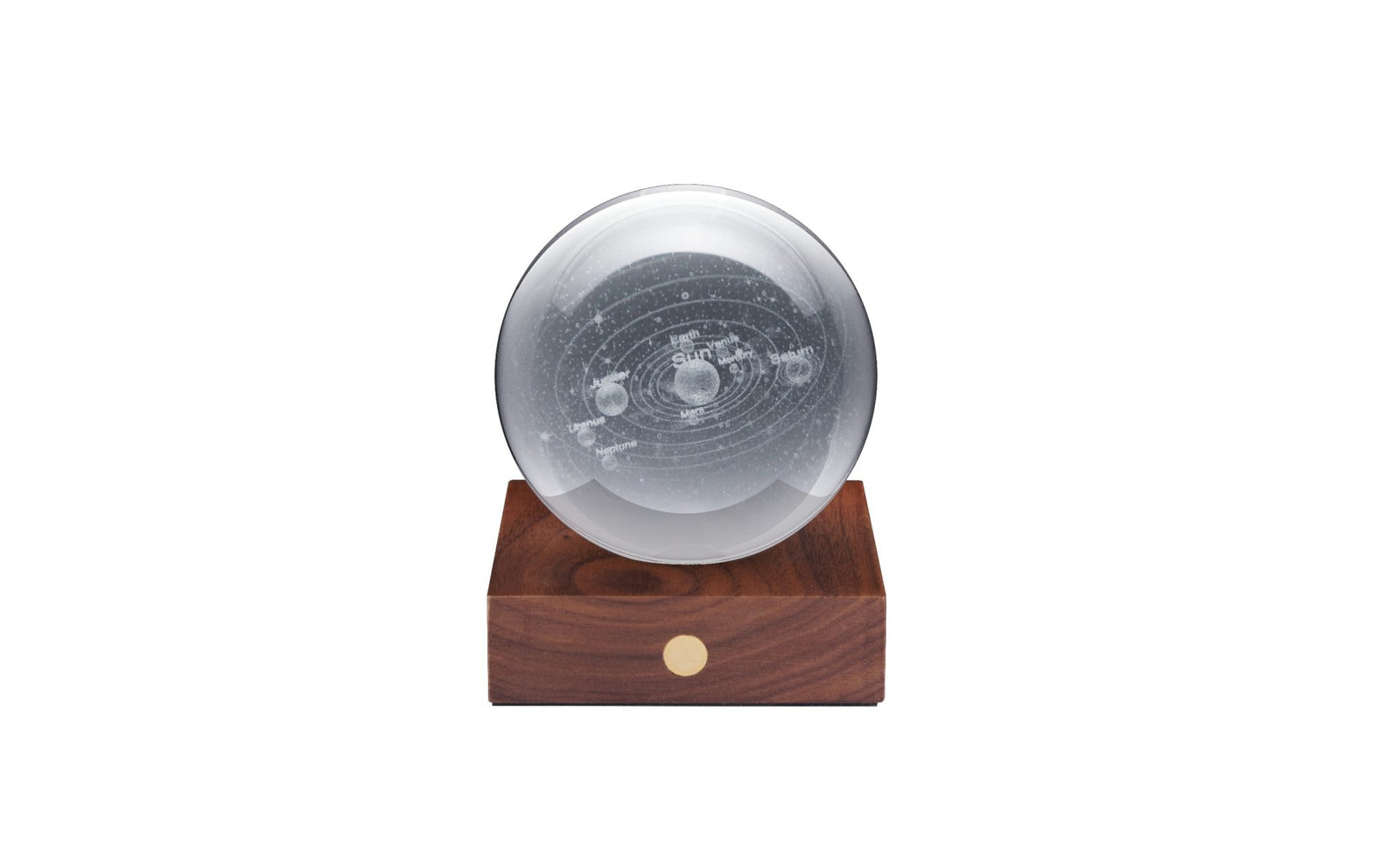 A polished amber crystal globe on a walnut wood base, with a solar system motif.